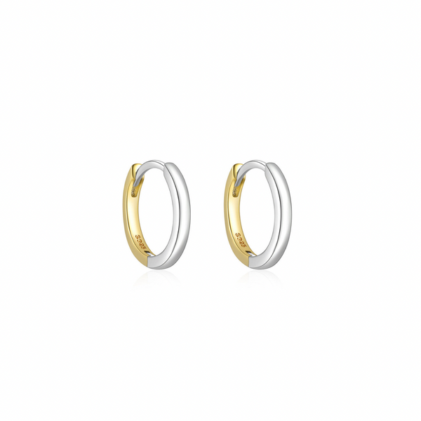 This two-tone round hoop earring allows you to easily switch between colors to match your different moods and occasions. Its unique design makes you stand out from the crowd.  Materials: High Quality Solid 925 Sterling Silver 18K Gold and White Gold Plating