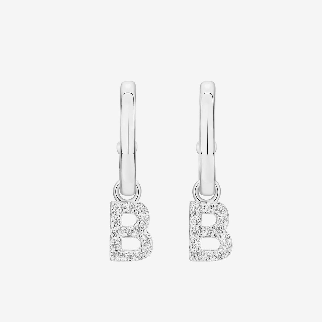 Letter and initial jewelry is a big trend right now. These Initial Hoop Earrings give any outfit a fashionable, contemporary look. You can personalize the earrings by choosing the stylish letter charms you want.  Materials: High Quality Solid &nbsp;925 Sterling Silver 5A Cubic Zirconia White Gold Plating